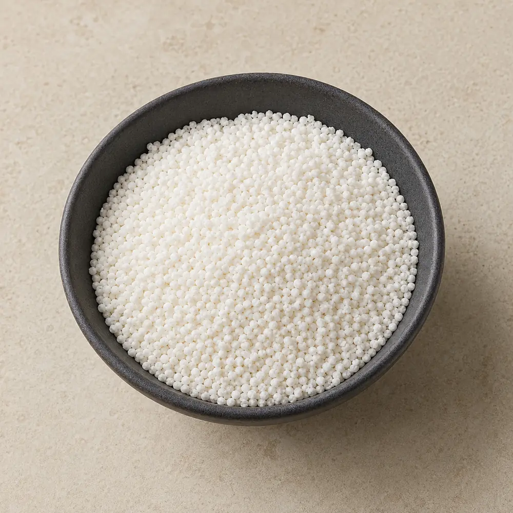 Small roasted Moti Sago in a dark ceramic bowl